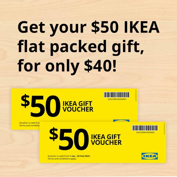 Image 94: Images of $50 IKEA Gift Voucher in yellow, placed on a light brown wooden background. Text reads 