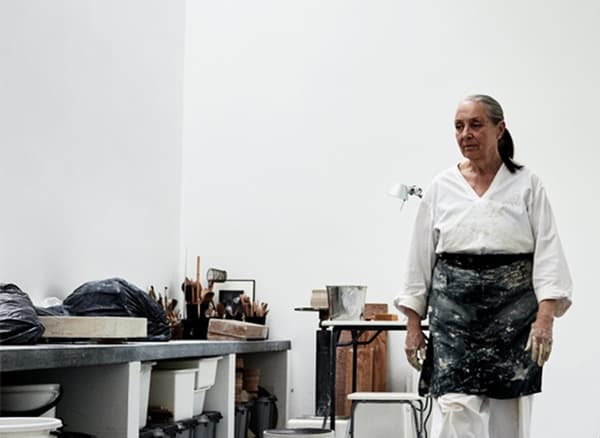 Ingegerd Råman wearing an apron in her workshop.