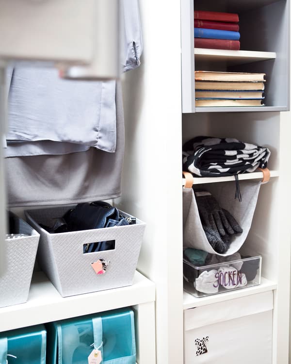 Inserts, shelves, and boxes inside a white wardrobe.