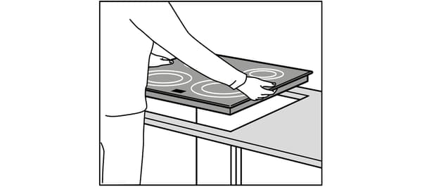 Installation of a hob in an IKEA kitchen.