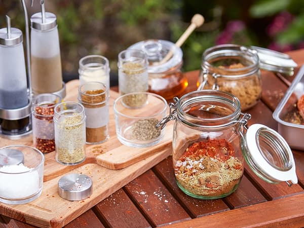 Jars containing various spces and condiments.