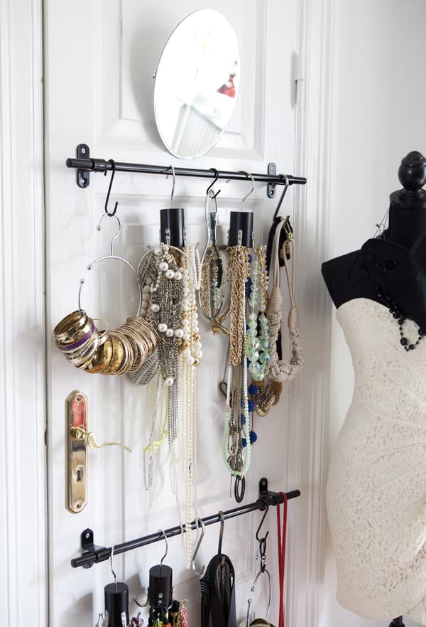 Jewellery displayed on rails.