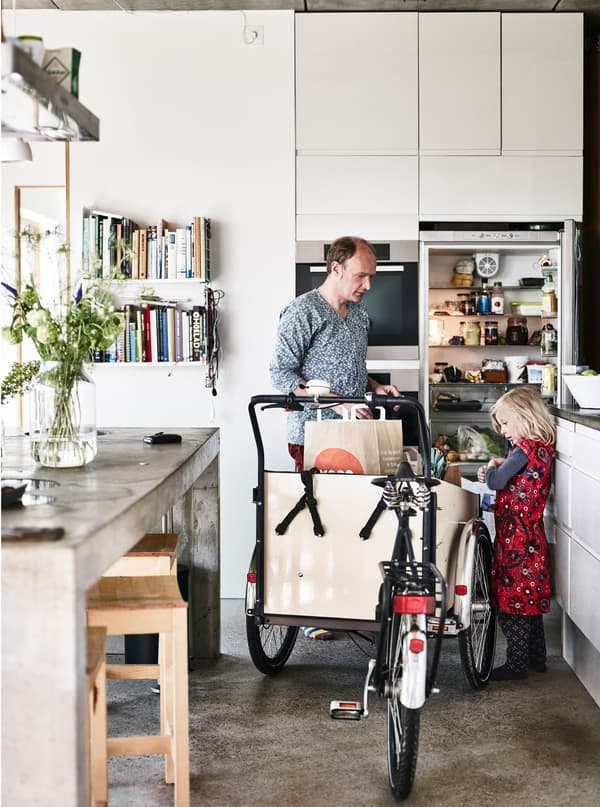 Karin and Cord can ride their bikes straight from the lift into their apartment