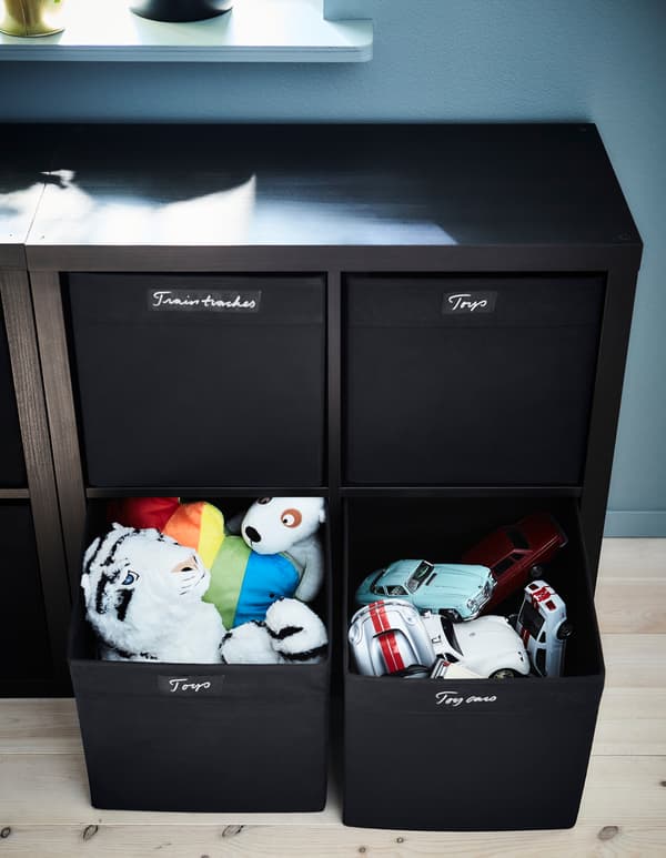 Keep your kids’ toys organised in labeled DRÖNA boxes that make them easy to find and put away.