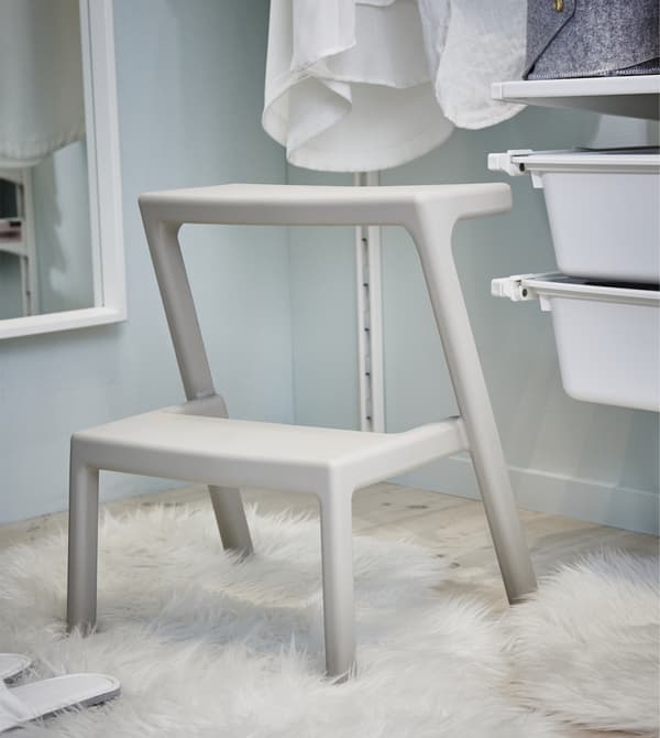 Keeping a comvenient step stool in the walk-in closet makes it easy to reach your items higher up.