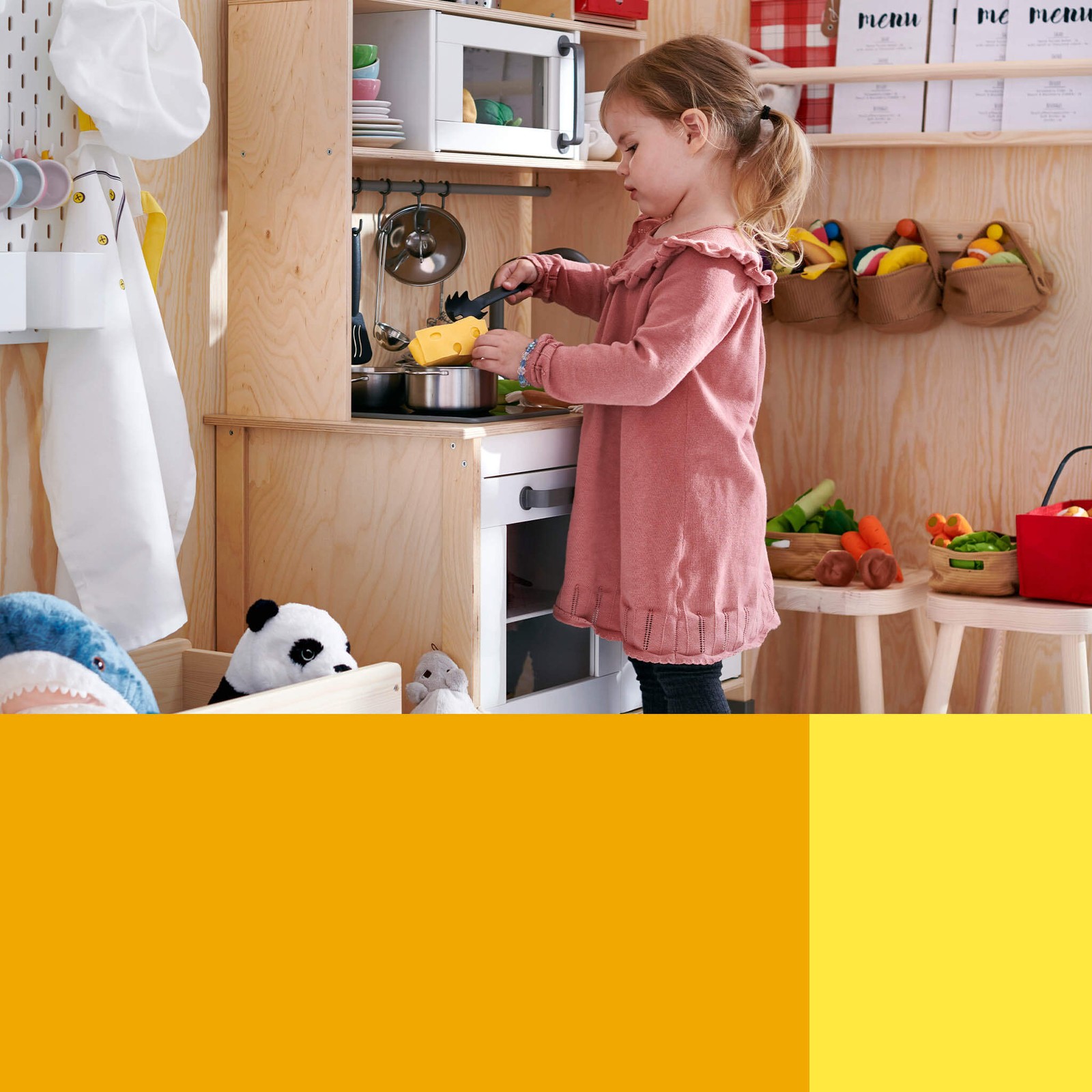 Kid playing with children's toys