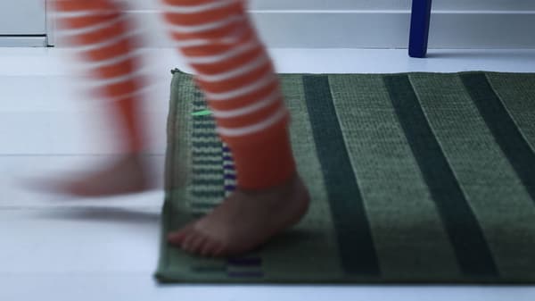 Kids feet runing on a rug