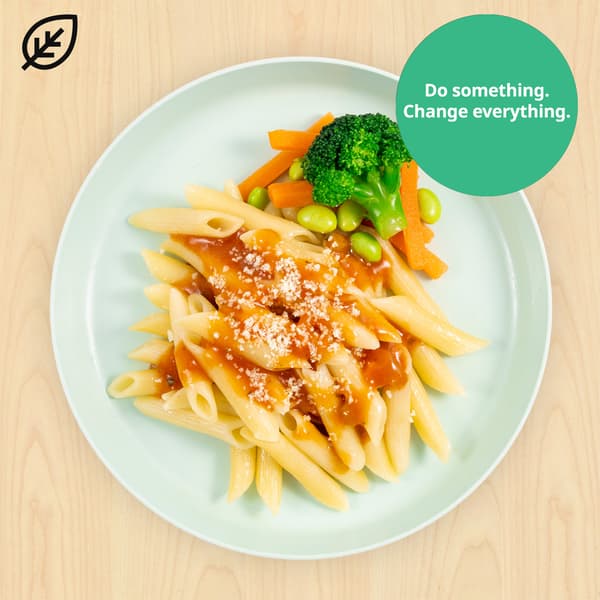 Kid's organic penne pasta with mixed vegetables and a green flag with a leaf symbol on it. A green circle is shown on top right with the words 