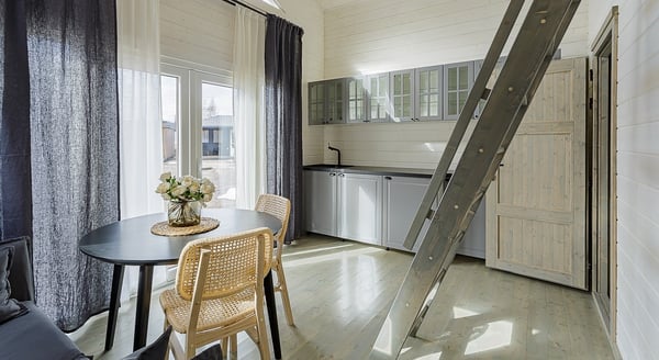 Kitchen and dining area in Scandinavian-style tiny house