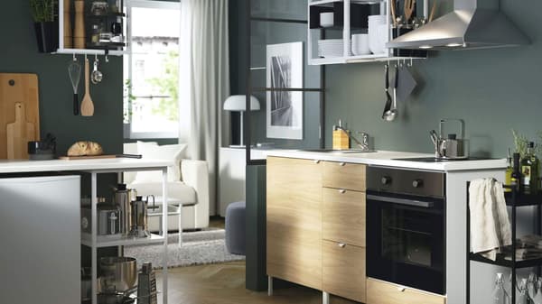 Kitchen sink with oven and livingroom with counter