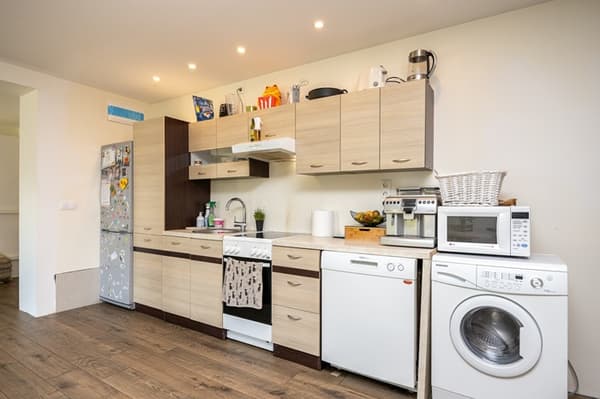  kitchen with fridge, and washing machine