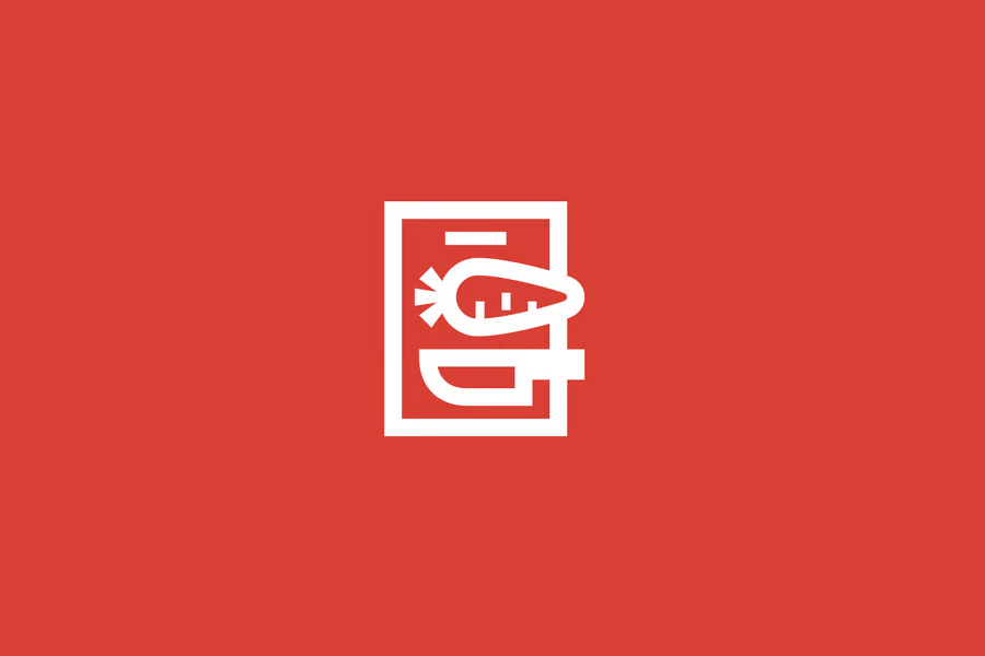 Knife and carrot on cutting board