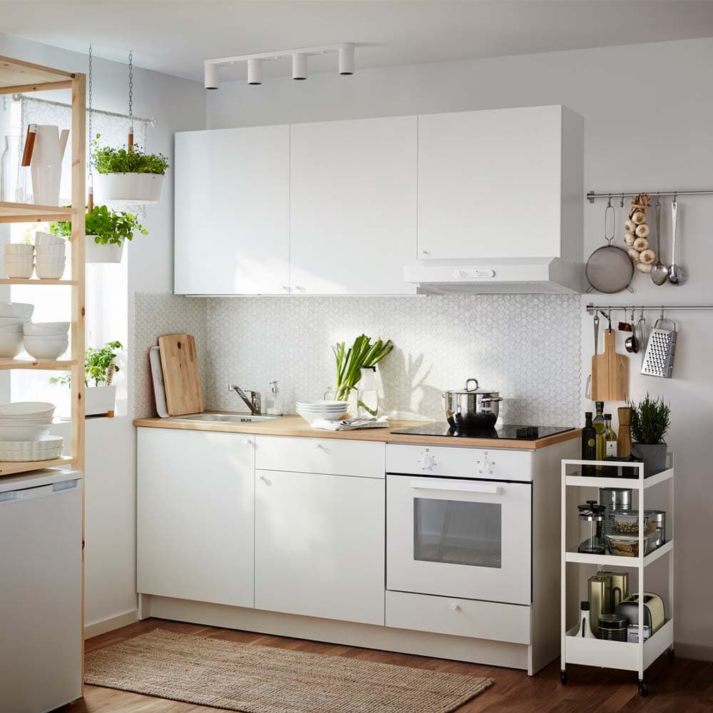 KNOXHULT unit kitchen with white NISSAFORS trolley