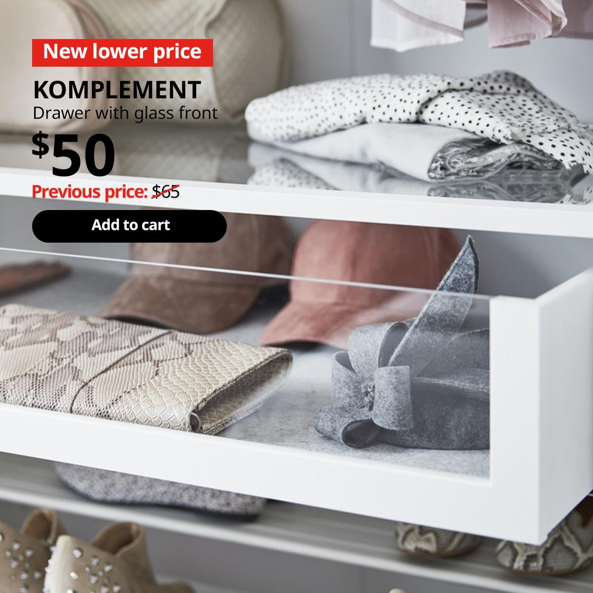 KOMPLEMENT drawer with glass front in a PAX wardrobe pulled out slightly. 