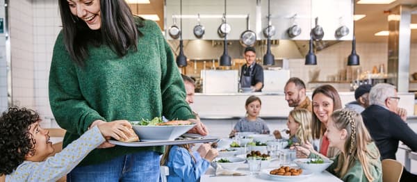 Large family sitting at lunch together.