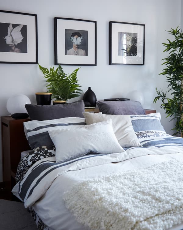 Layer pillows, cushions and throws for a cosy bedroom.