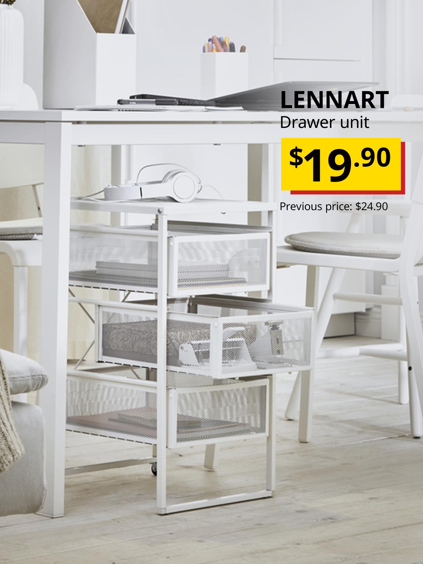 LENNART drawer unit placed under a white study table with various stationery and books placed in the drawers. 