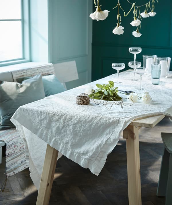 Let a classic white cloth be the base for a summary table. Try IKEA GULLMAJ cream white tablecloth!