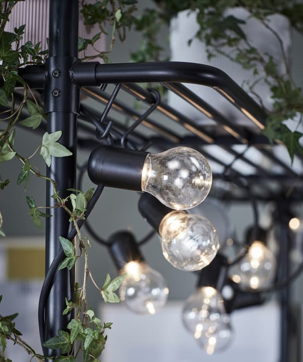 Lighting chains set the mood just as well indoors. Like here, highligting the VADHOLMA rack. LEDs make them practical, too.