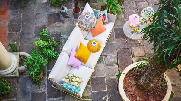 Link to 'How to staycation like a true vacation' - image of a bird's eye view of a colourful outdoor space.