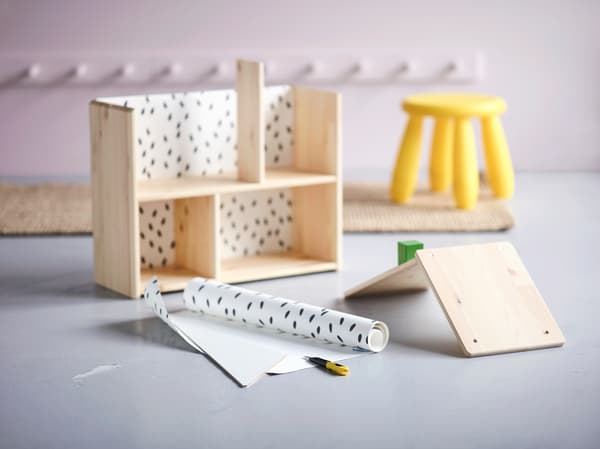 Little wooden house being built.