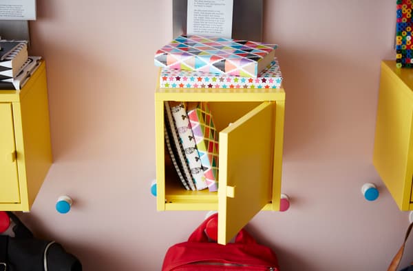Lockers on the wall are great for storing schoolbooks, with hooks for bags underneath.