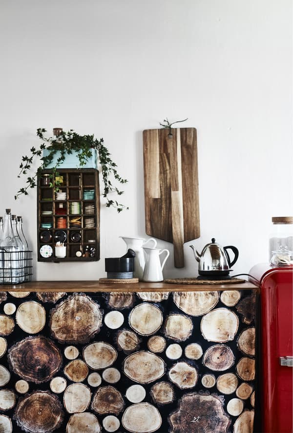 Log-print fabric draped in front of a kitchen counter.