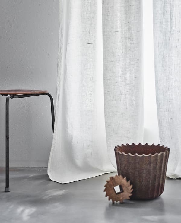 Long, flowing curtains combined with industrial pieces is an upcoming trend according to our IKEA stylist.