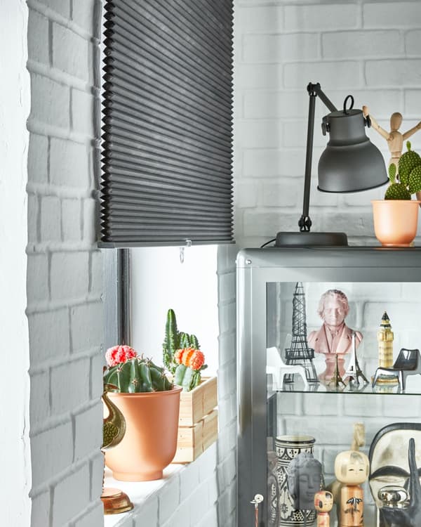 Lower the blinds and install a blackout blind to regulate the temperature