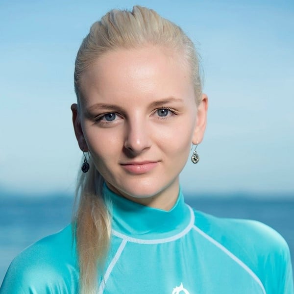 Magda Jentgena smiling in blue shirt