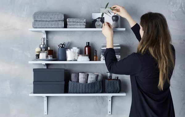 Make a calm and practical bathroom wall display.