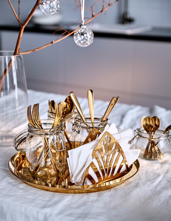 Make holiday dinner time fuss free with a party tray with cutlery. IKEA has a lot of trays such as GLATTIS brass-coloured tray in stainless steel. Carrying this tray is made easy by the protective edge, which keeps your items from sliding off.