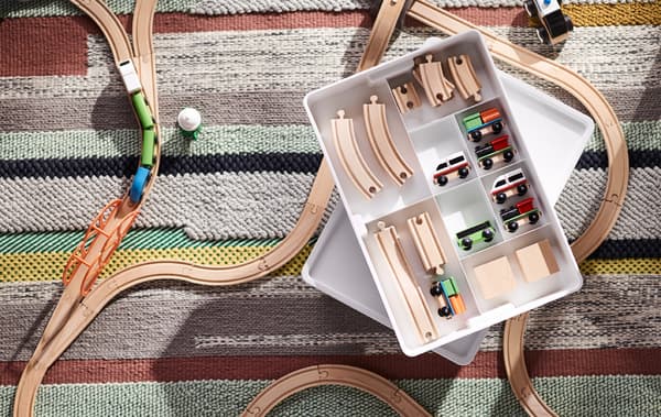 Make it easier for the little ones with smart storage ideas in your hallway. Use a rack with hooks at floor level so the kiddos can easily hang up their shoes.