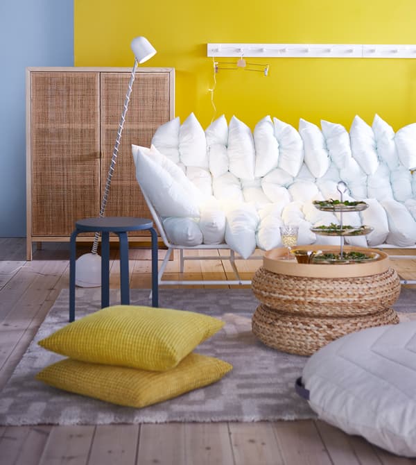 Make room for extra guests by gathering all of the chairs, stools and cushions to form a comfy lounge area.