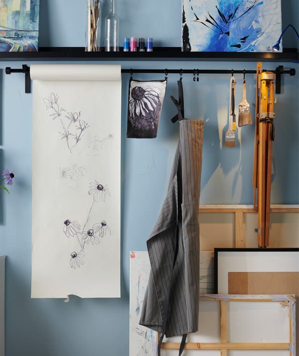 Make yourself a creative spot. Paint when you want to by using a paper roll, just pull down more paper when inspiration strikes. Try the IKEA MÅLA drawing paper roll.