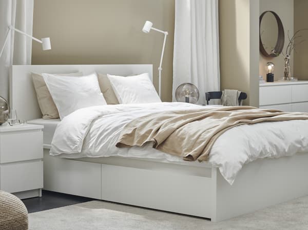 MALM bedrame with linen and night tables.