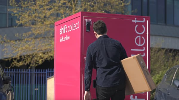 Man collecting parcel from shift locker pick-up point