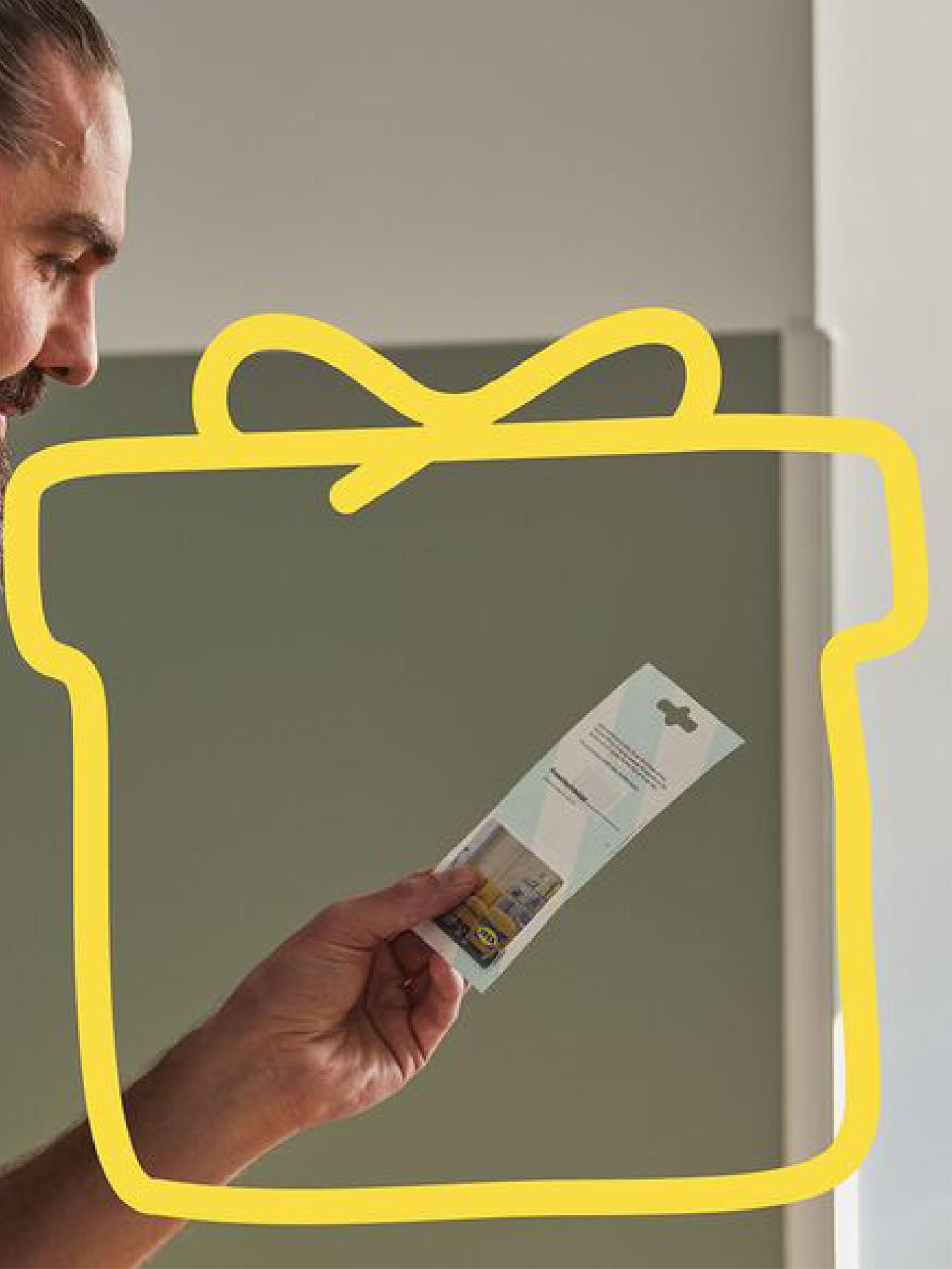 Man holding IKEA gift card