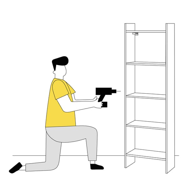 Man installing IKEA Cabinet