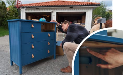 man looking at chest of drawers