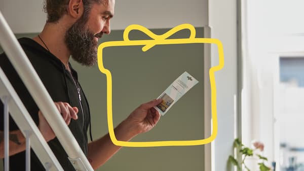 Man looking at IKEA Gift card