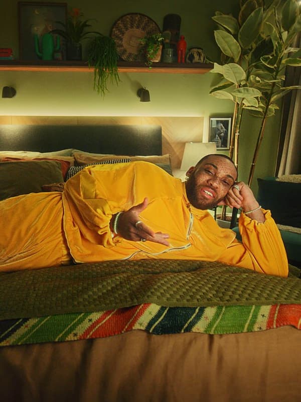Man lying down on a bed