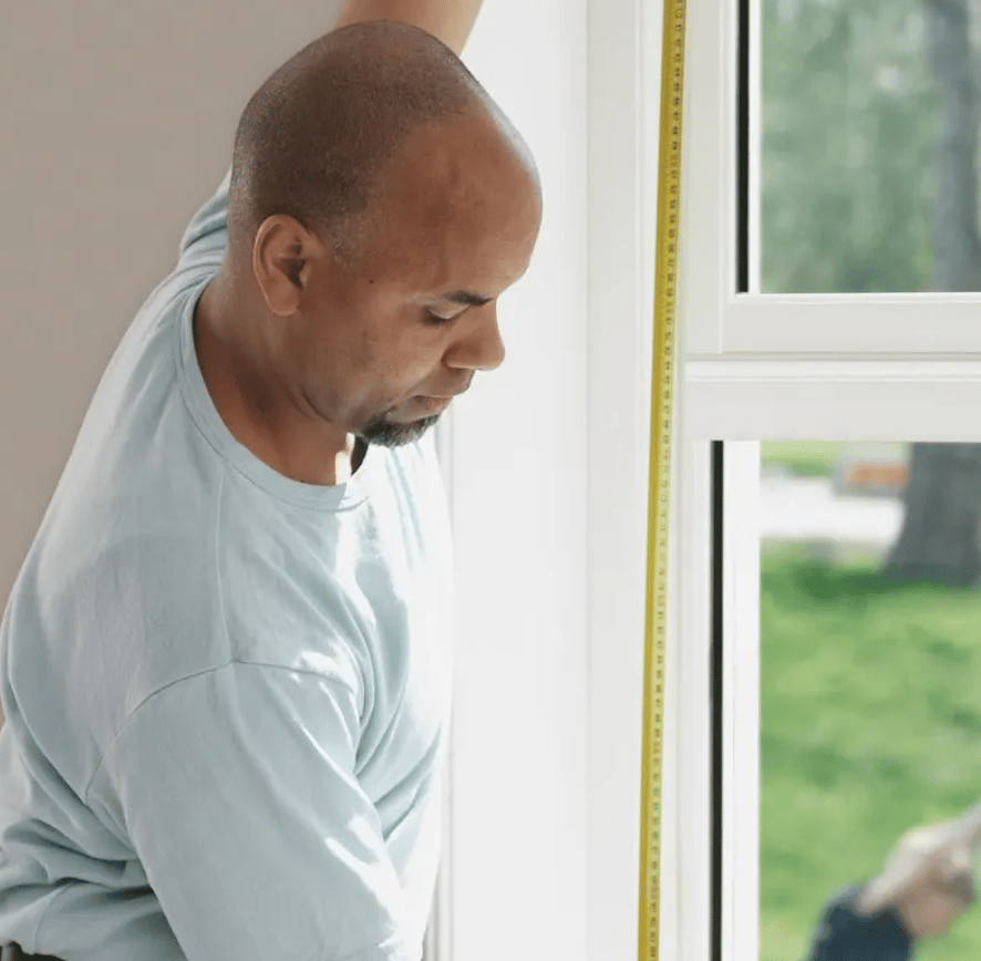 Man measuring a window
