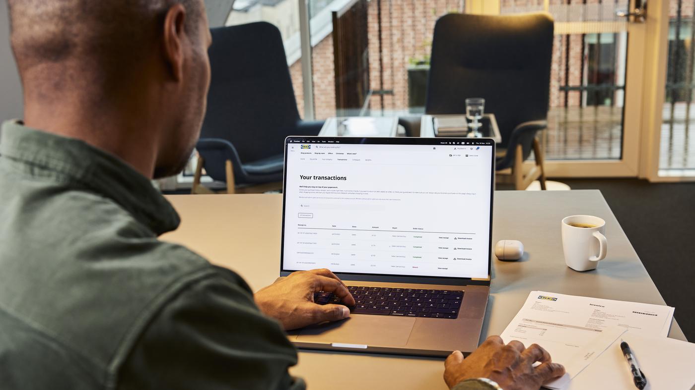 man sitting at computer