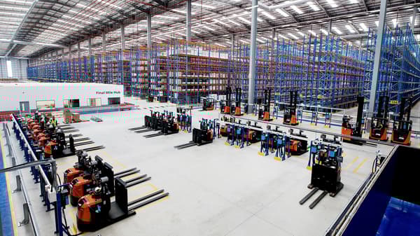 Many forklifts in hall