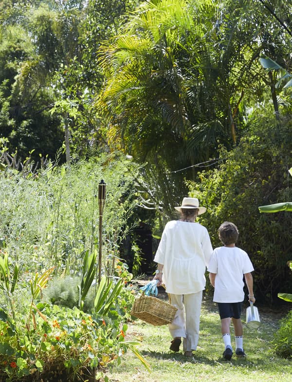 Margaret and her grandson in the garden