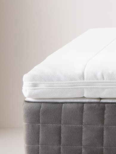 Mattress topper on top of a mattress