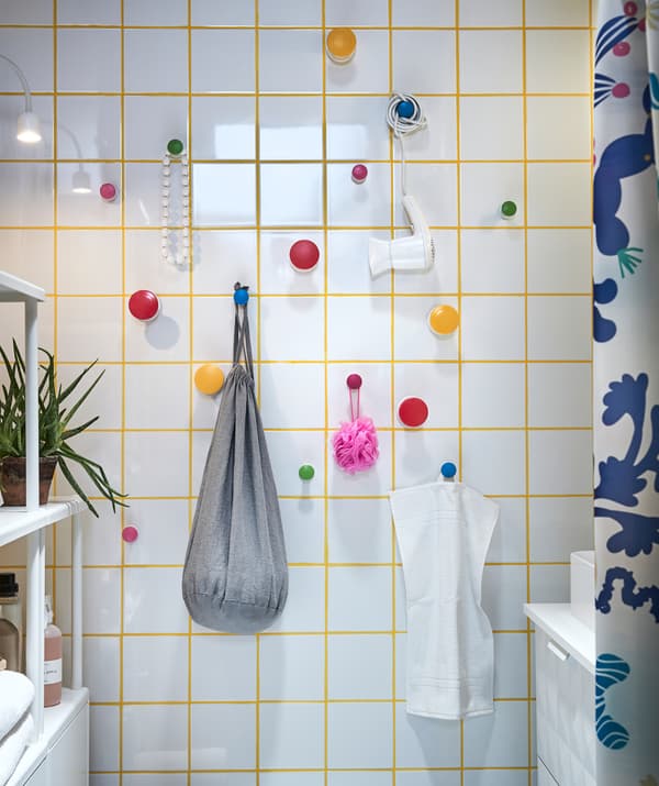 Maximise your bathroom storage! Attach easy-to remove hangers such as LOSJÖN with self-adhesive backings to a wall where you can hang different storage containers!