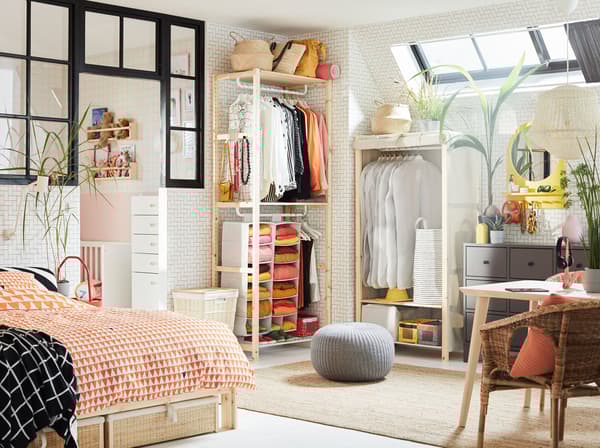 Maximise your small space bedroom or loft with IVAR pine shelving unit as an open storage wardrobe, complete with protective covers for clothes and smart lighting solutions for sideway windows with DIGNITET curtain rails.