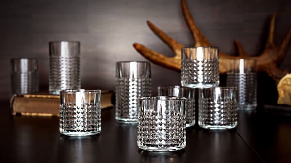 Mid century modern décor - Whiskey glass on black table